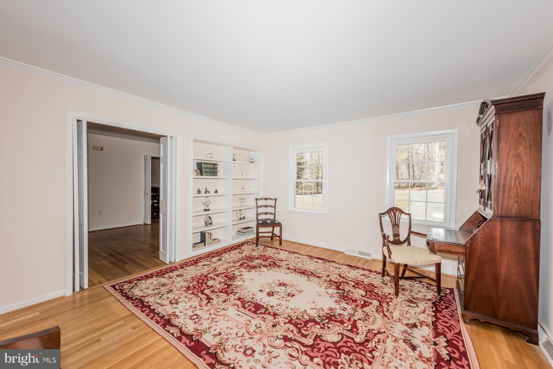 13602 Royal Crest Road Phoenix, MD 21131 - Photo 4 of 29 a bedroom with a bed and wooden floor