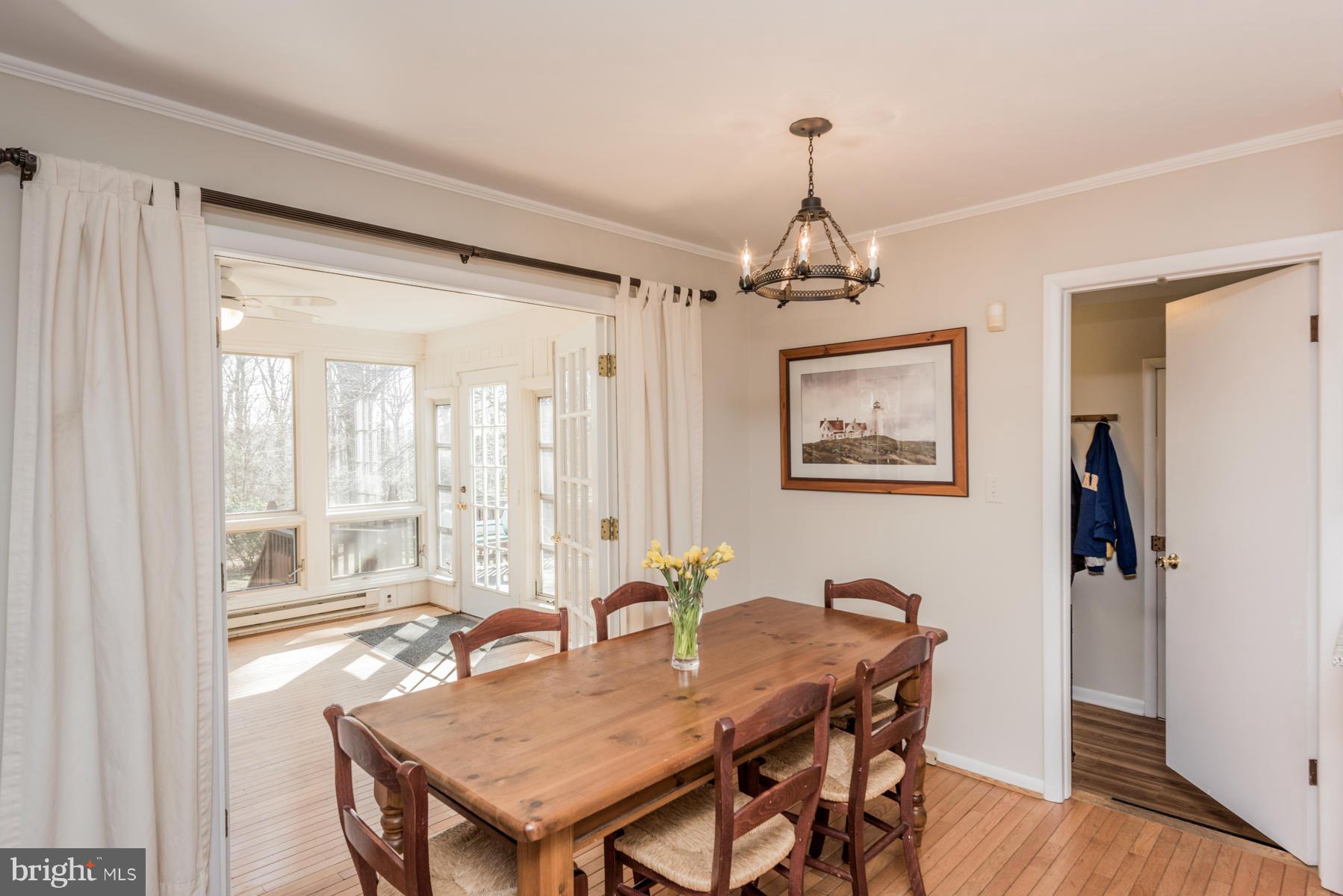 13602 Royal Crest Road Phoenix, MD 21131 - Photo 6 of 29 a view of a dining room with furniture window and wooden floor