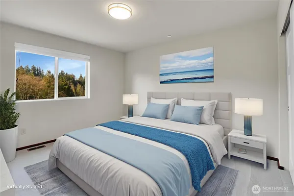 a bedroom with a bed and a dresser