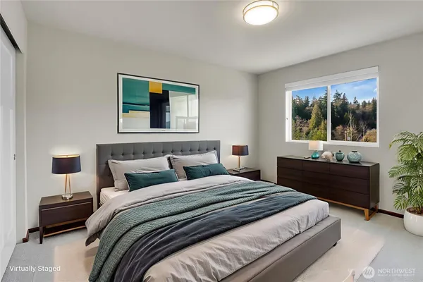 a bathroom with a sink a toilet a mirror and shower curtain