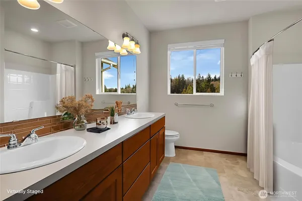 a bathroom with a sink double vanity granite and a sink