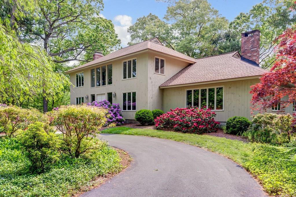 33 Laxfield Road Weston, MA 02493 - Photo 1 of 21 a view of a white house with a big yard and potted plants