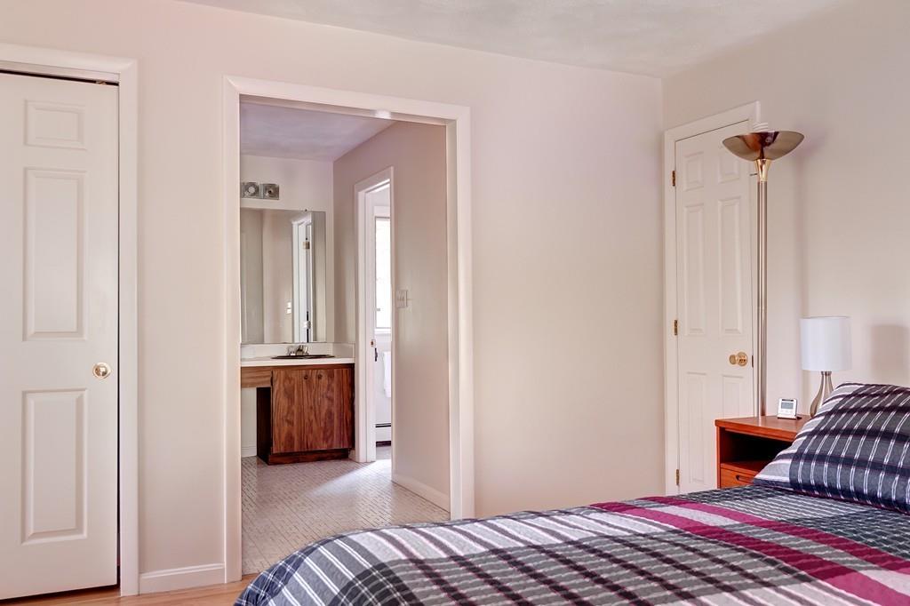 33 Laxfield Road Weston, MA 02493 - Photo 14 of 21 a bedroom with a bed and a view of bathroom
