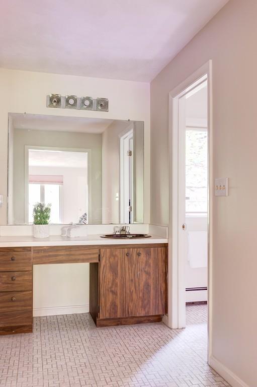 33 Laxfield Road Weston, MA 02493 - Photo 15 of 21 a spacious bathroom with a double vanity sink and a mirror