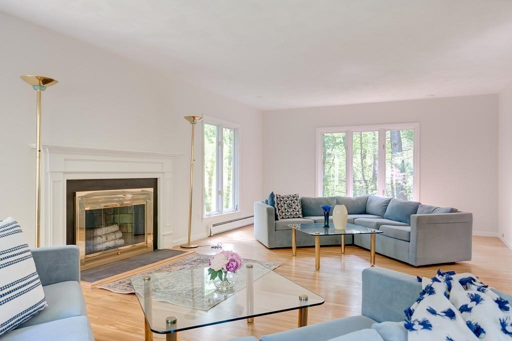 33 Laxfield Road Weston, MA 02493 - Photo 3 of 21 a living room with furniture and a fireplace