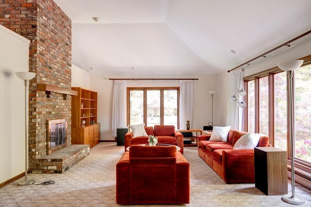 33 Laxfield Road Weston, MA 02493 - Photo 10 of 21 a living room with furniture windows and a flat screen tv