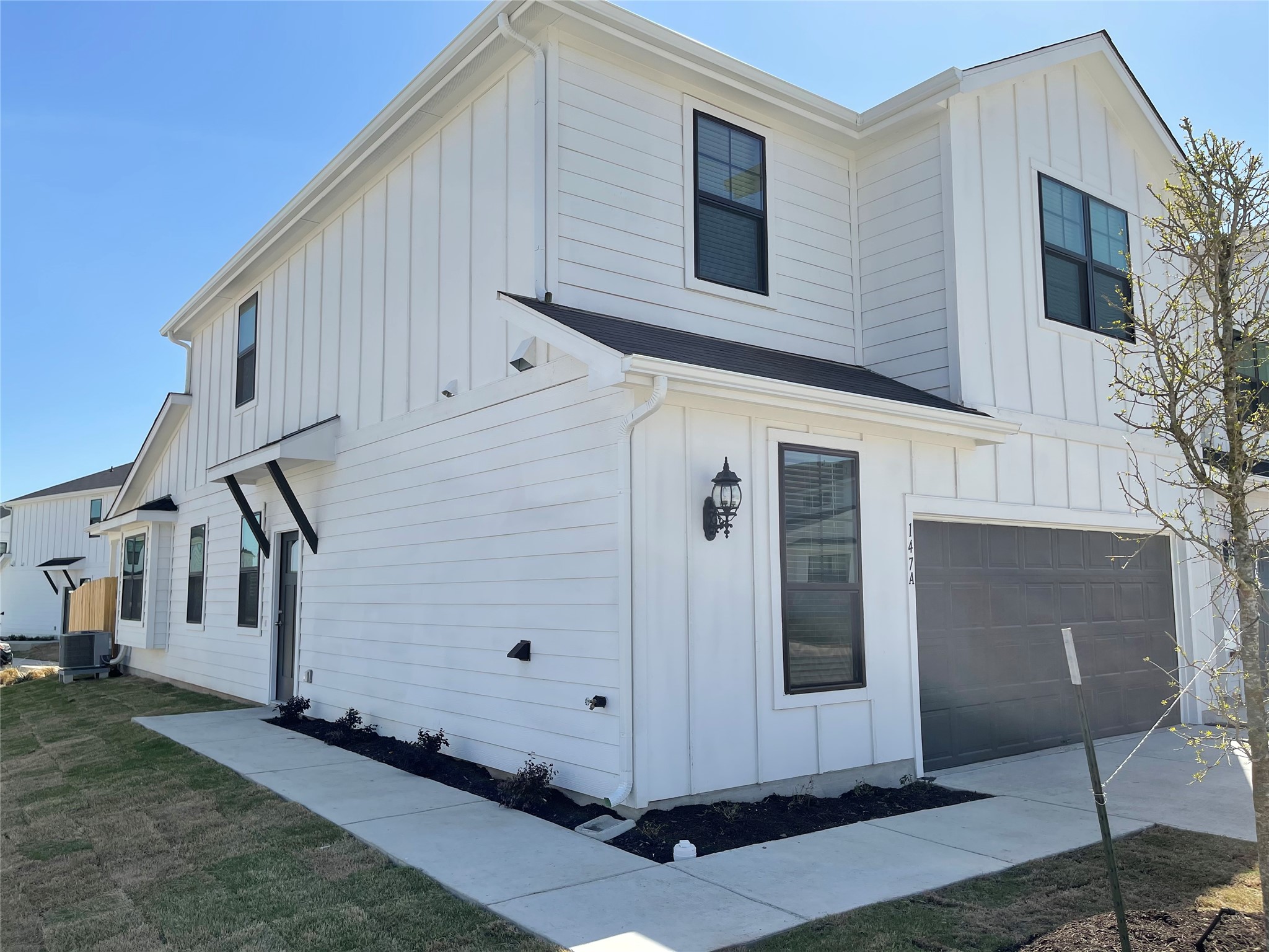 147 Waterside Road, Unit A Buda, TX 78610 - Photo 1 of 1 Clean lines and a striking modern profile define this appealing two-story residence.