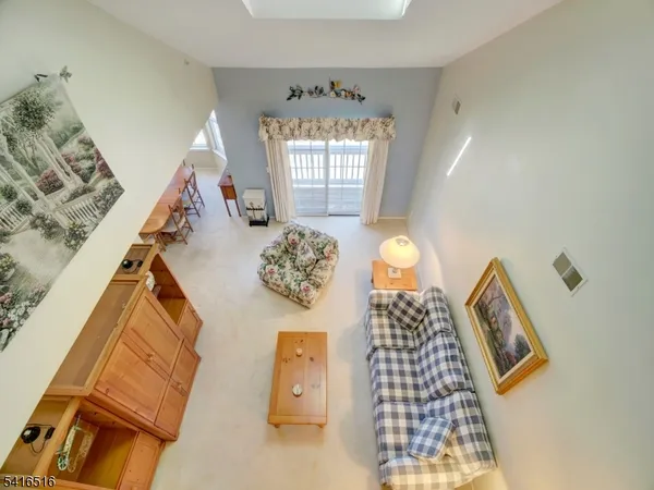 a view of living room with furniture and a window
