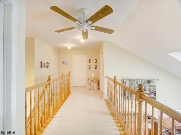 a view of a hallway view with staircase