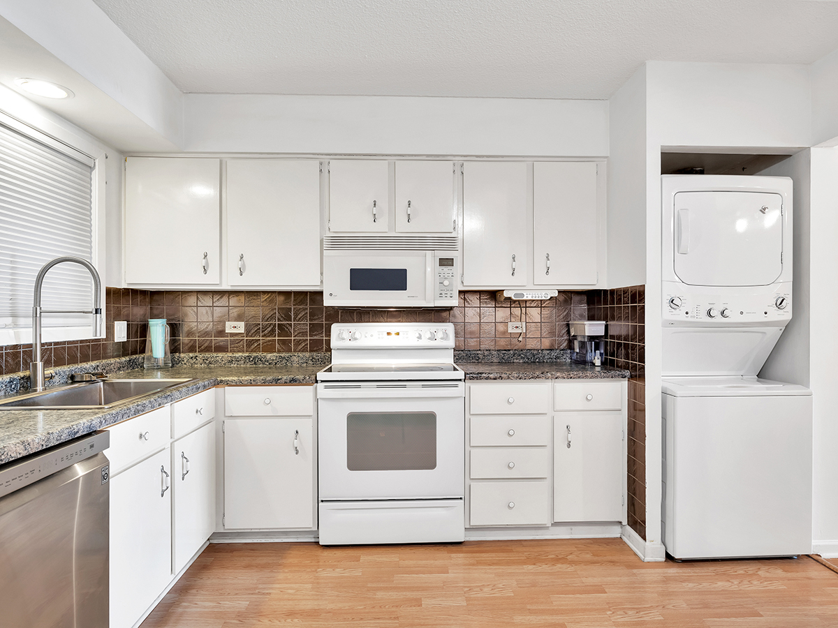961 North Rohlwing Road, Unit GB Addison, IL 60101 - Photo 8 of 15 a kitchen with granite countertop white cabinets and white appliances