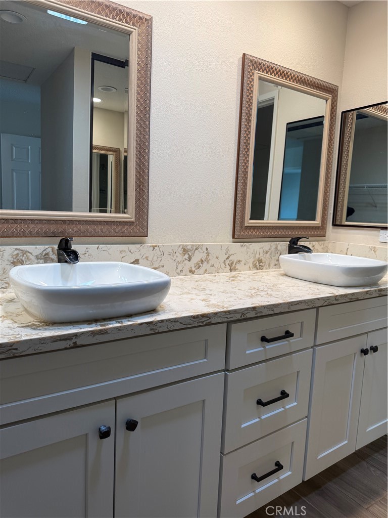 33706 Surfside Drive, Unit 146 Dana Point, CA 92629 - Photo 10 of 17 a bathroom with vanity sink and a mirror