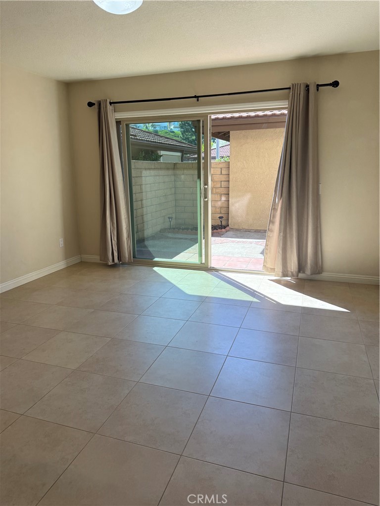 33706 Surfside Drive, Unit 146 Dana Point, CA 92629 - Photo 4 of 17 a view of an empty room with a fireplace