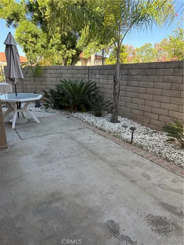 a view of staircase with white walls and a window