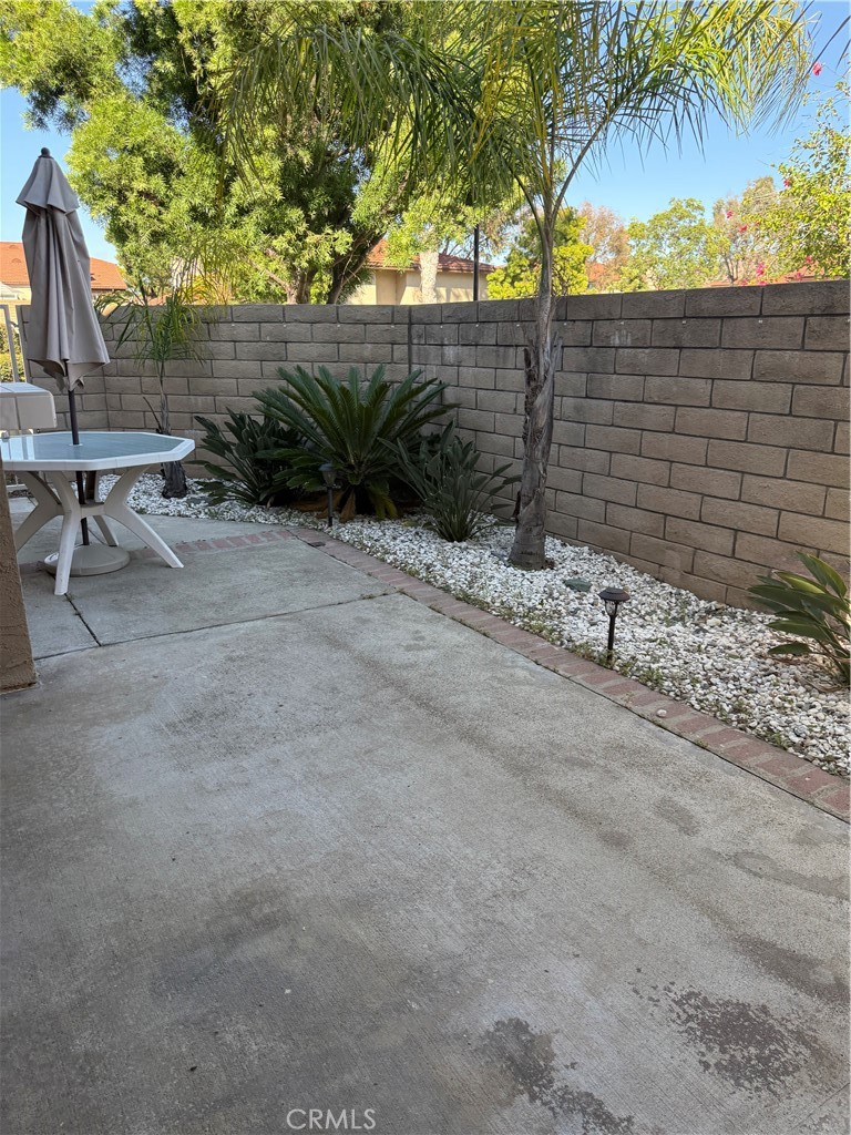 33706 Surfside Drive, Unit 146 Dana Point, CA 92629 - Photo 8 of 17 a backyard of a house with lots of green space