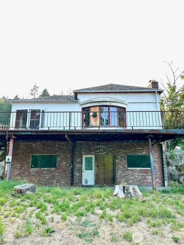 a view of a room with wooden walls