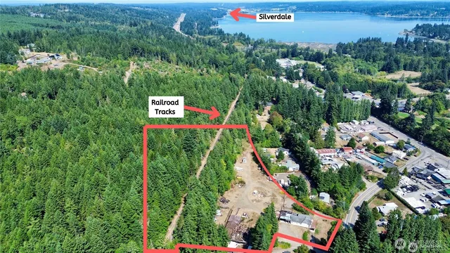 an aerial view of a residential houses with an outdoor space