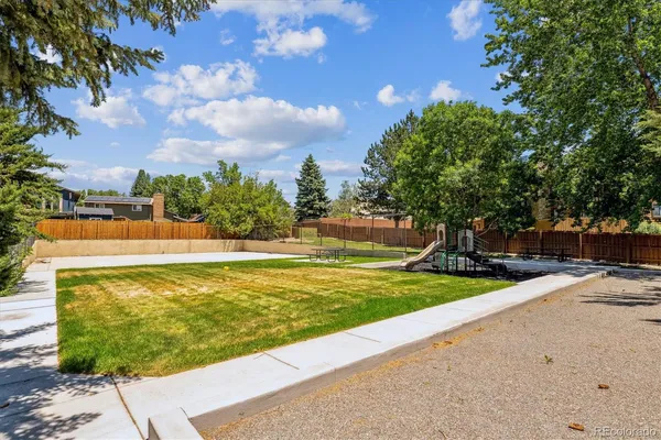 a view of a swimming pool with an outdoor space and seating area