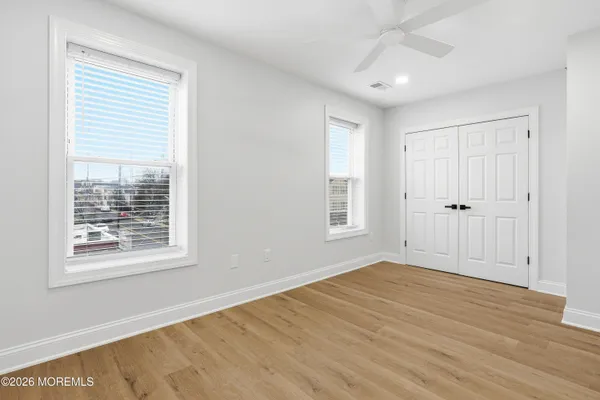an aerial view of a residential apartment building with parking space