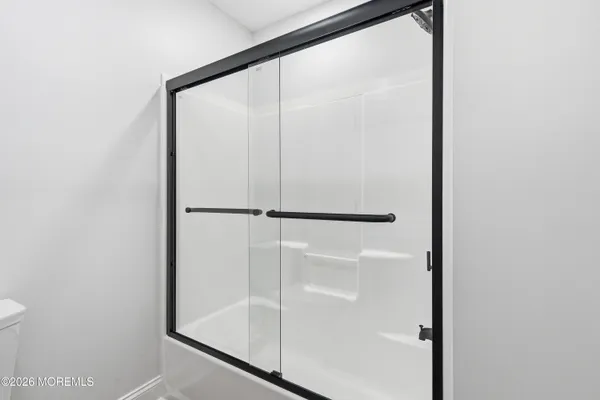 an aerial view of residential houses with street