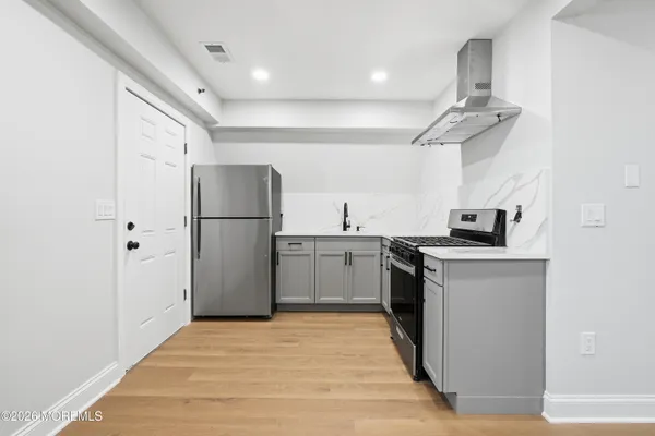 an aerial view of a house with wooden stairs