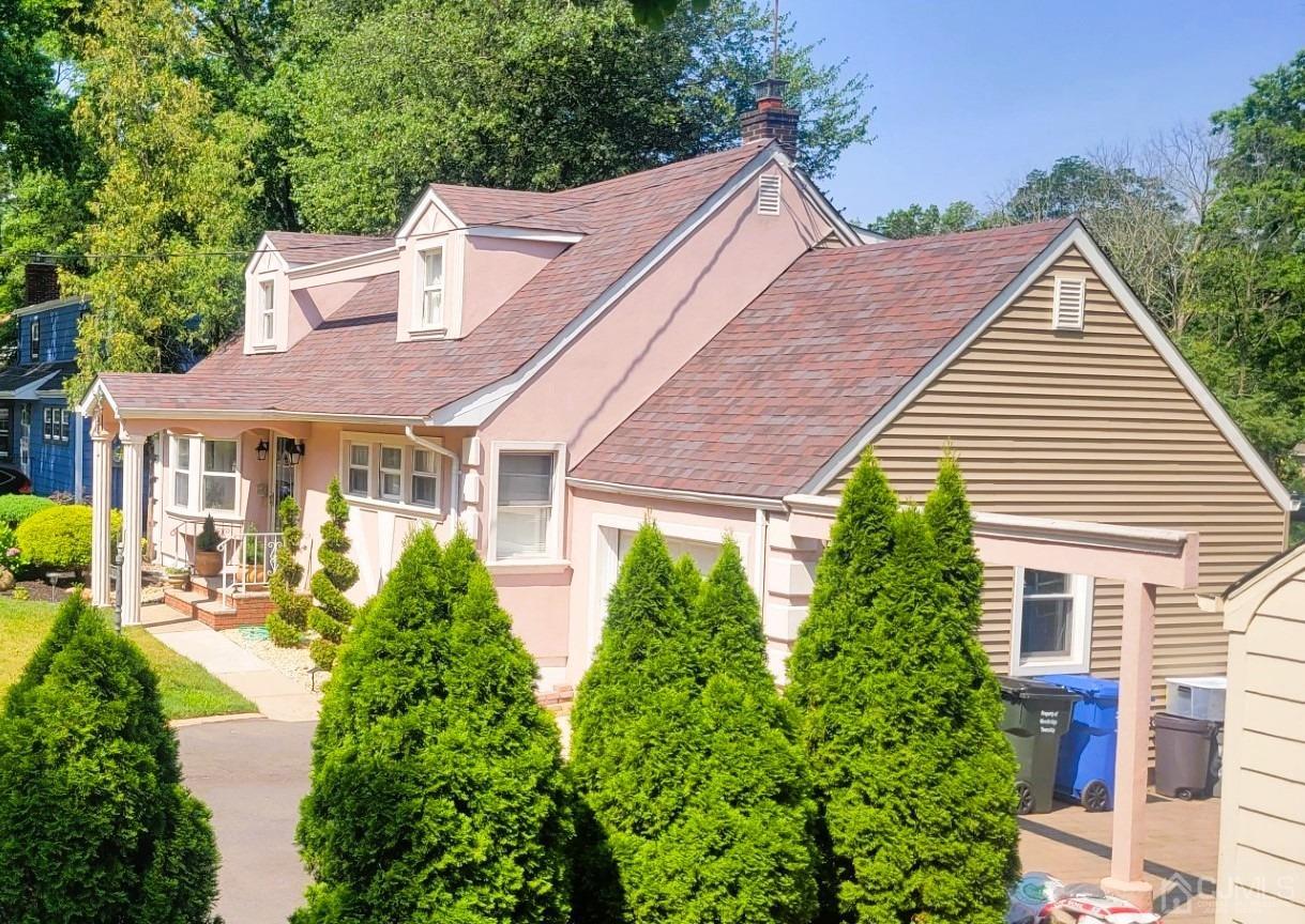 412 Chain O' Hills Road Colonia, NJ 07067 - Photo 1 of 34 a view of a house with garden