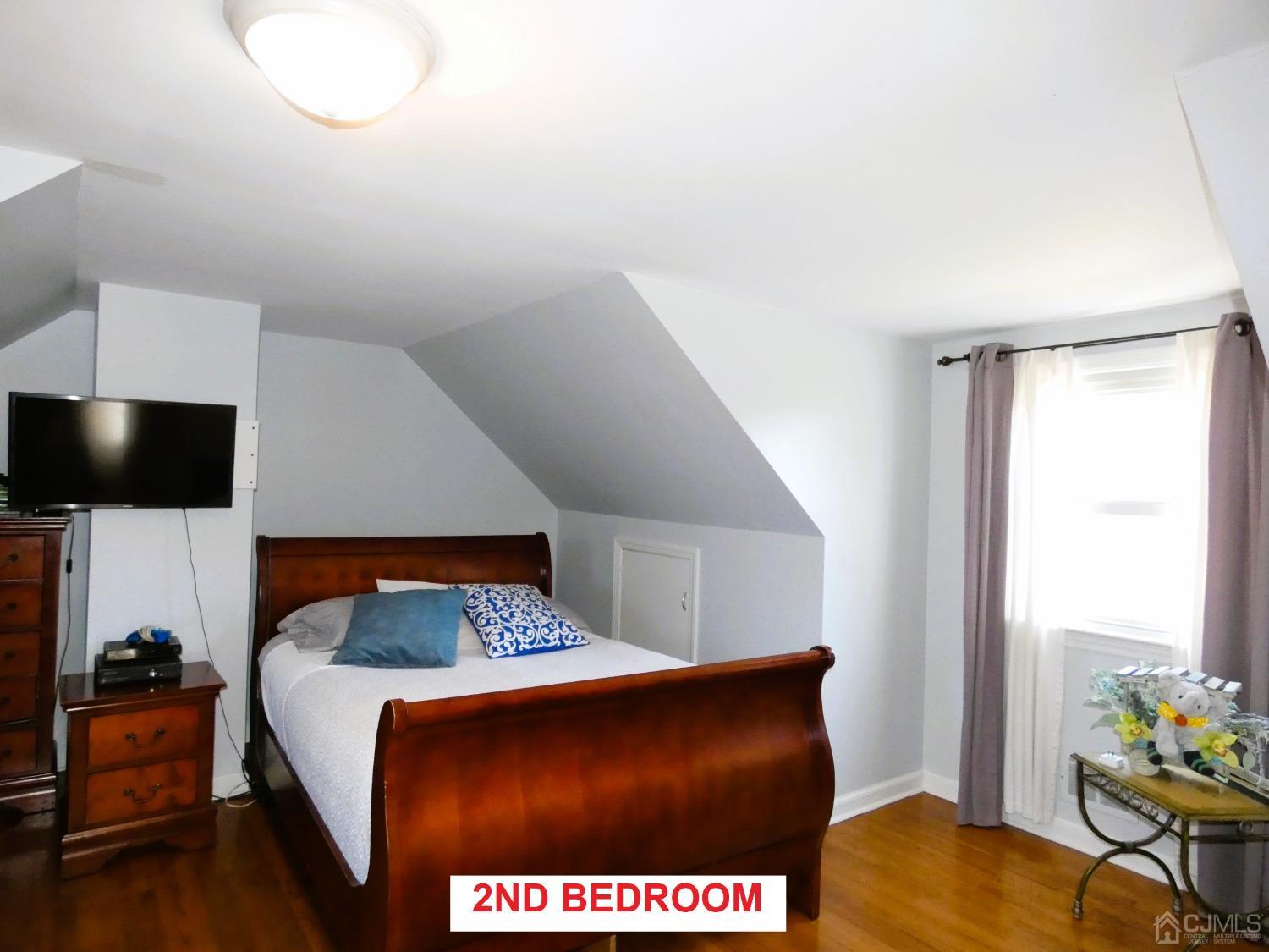 412 Chain O' Hills Road Colonia, NJ 07067 - Photo 14 of 34 a bedroom with a bed and furniture