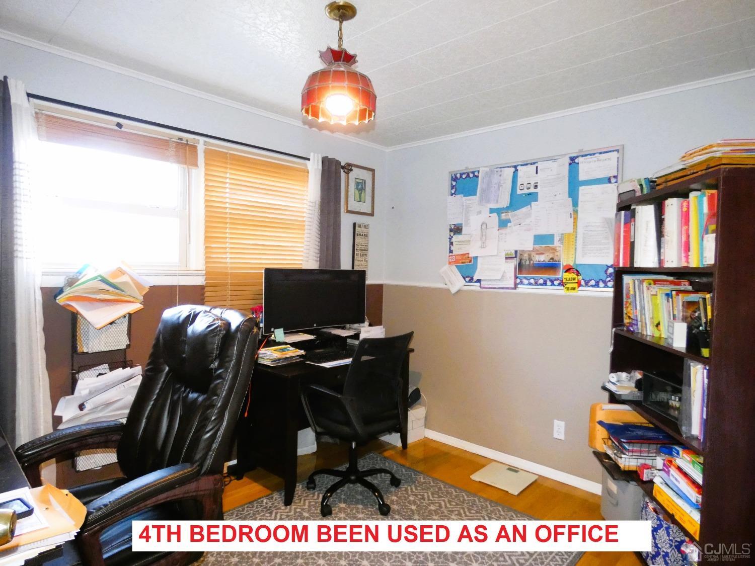412 Chain O' Hills Road Colonia, NJ 07067 - Photo 17 of 34 a view of a workspace with furniture and a window