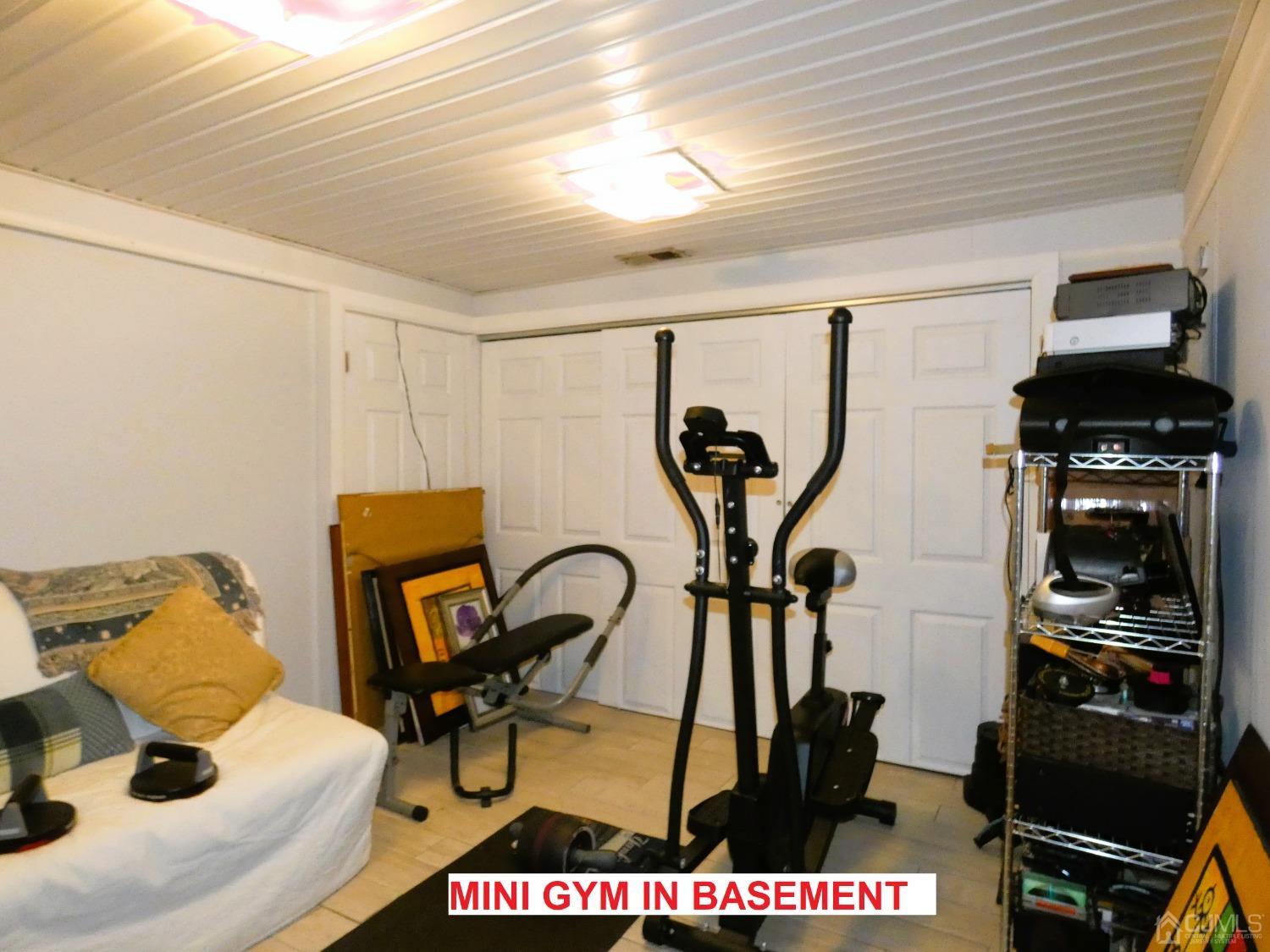 412 Chain O' Hills Road Colonia, NJ 07067 - Photo 20 of 34 a view of a room with gym equipment