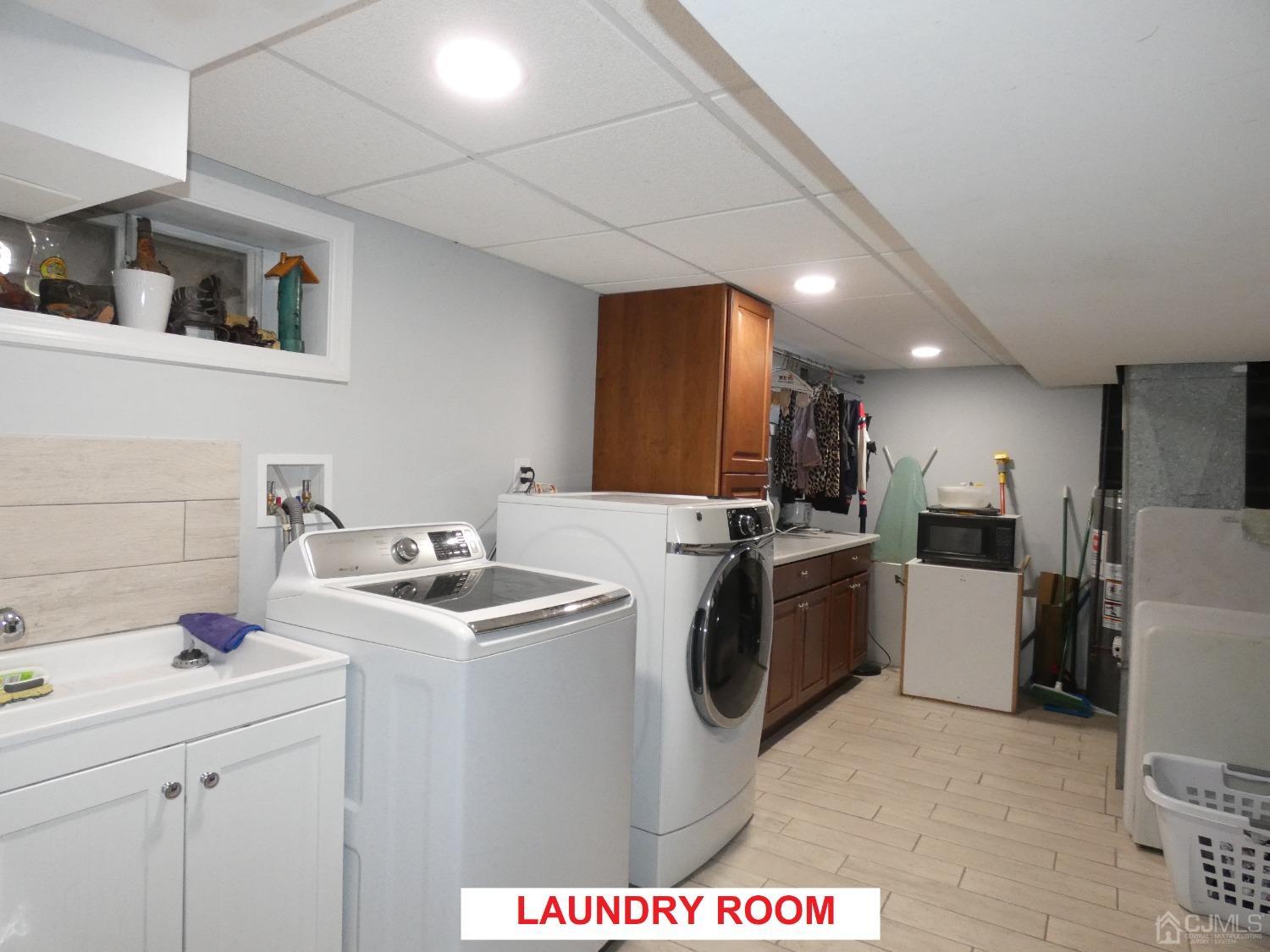412 Chain O' Hills Road Colonia, NJ 07067 - Photo 25 of 34 a view of a kitchen with sink stove and furniture