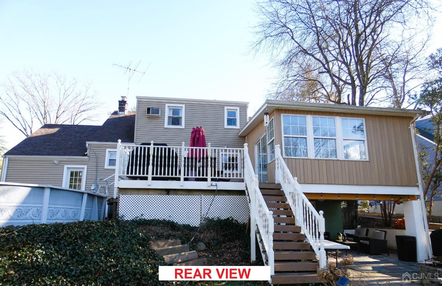 412 Chain O' Hills Road Colonia, NJ 07067 - Photo 31 of 34 front view of a house with a small yard