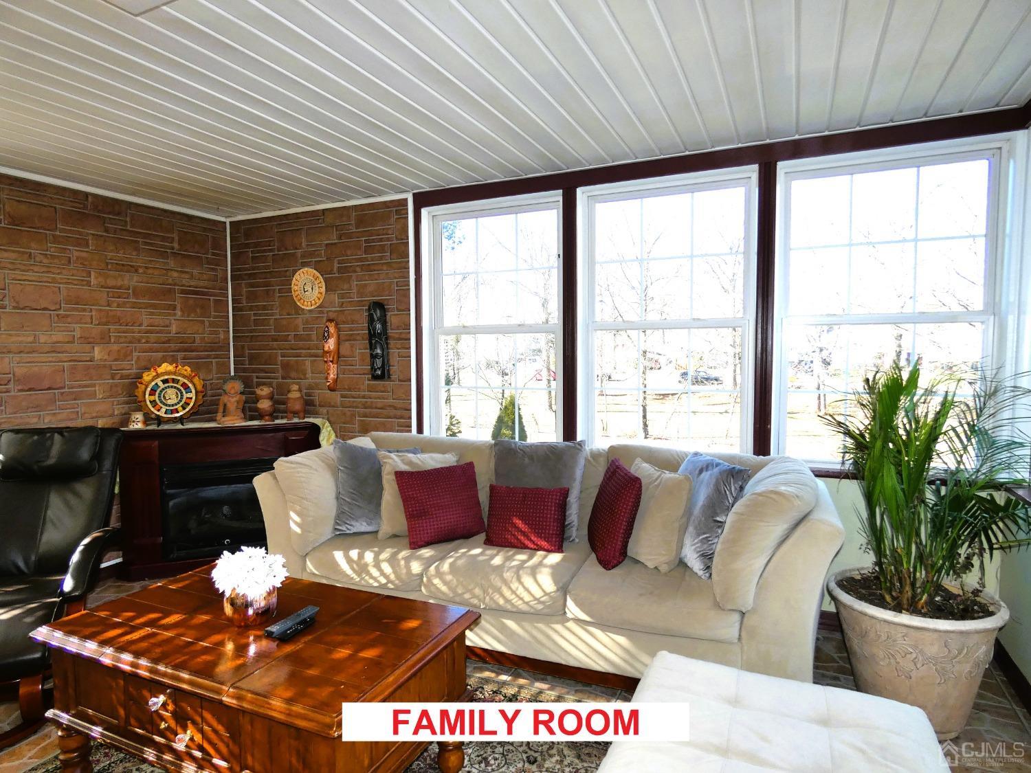 412 Chain O' Hills Road Colonia, NJ 07067 - Photo 6 of 34 a living room with furniture and a large window
