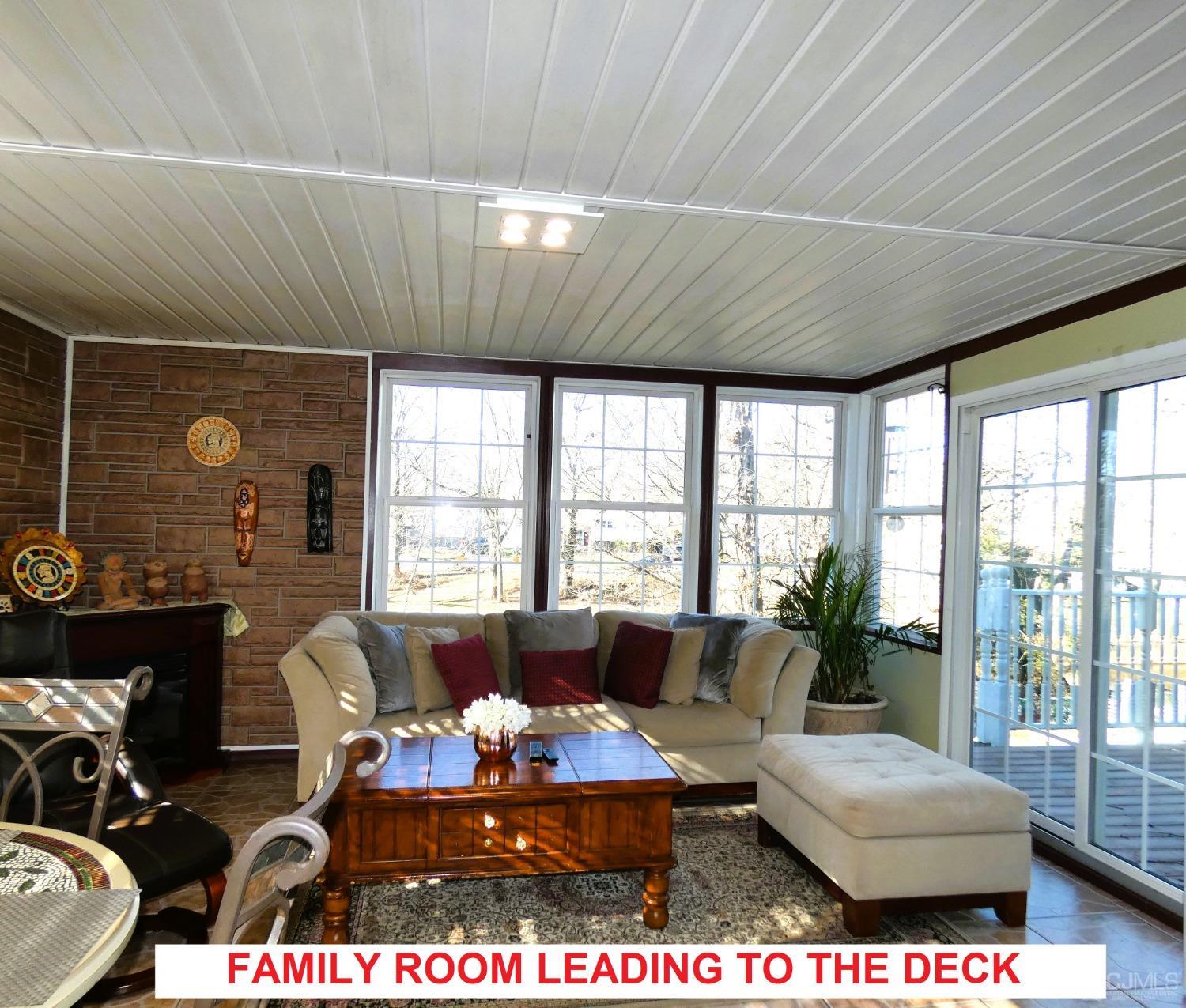 412 Chain O' Hills Road Colonia, NJ 07067 - Photo 7 of 34 a living room with furniture and a large window