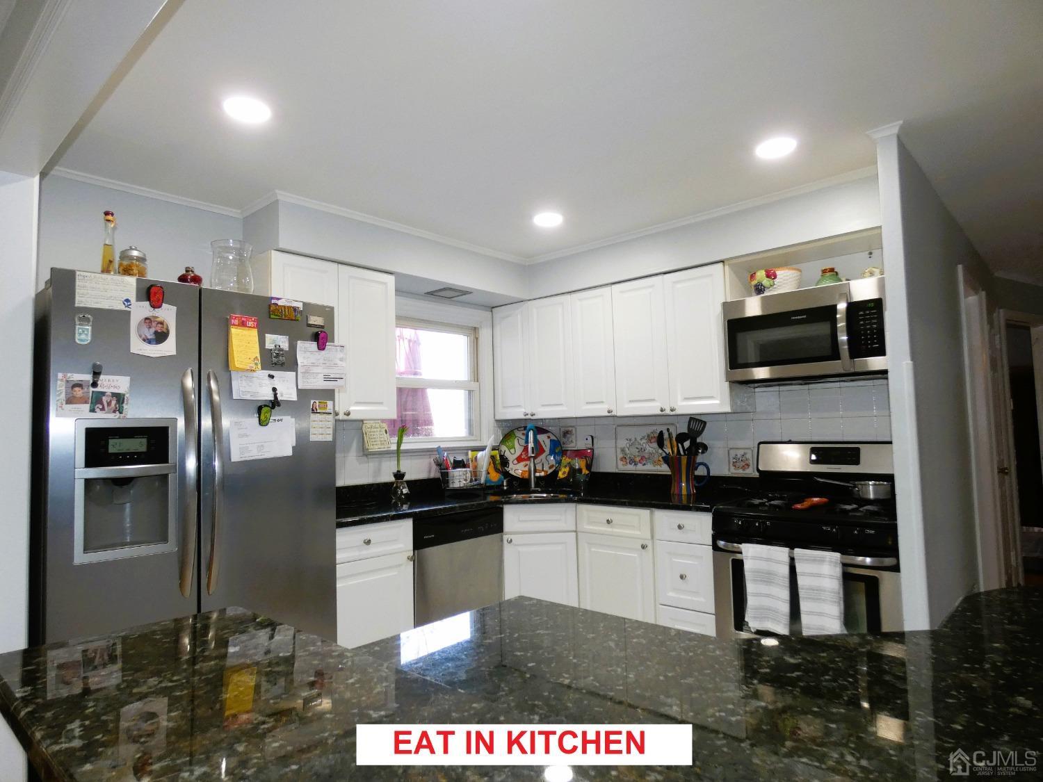 412 Chain O' Hills Road Colonia, NJ 07067 - Photo 10 of 34 a kitchen with a sink stainless steel appliances and cabinets