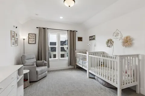 a living room with furniture and windows