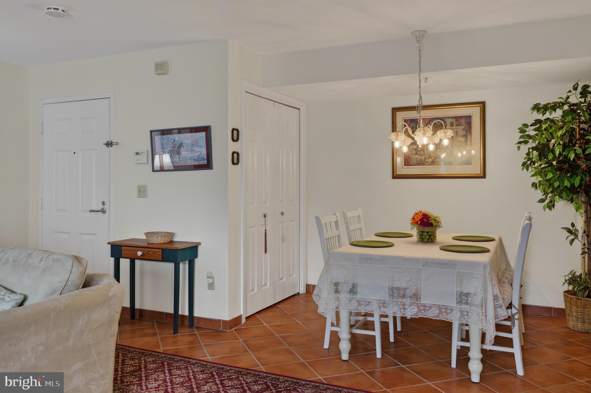 936 Bay Ridge Avenue, Unit 201 Annapolis, MD 21403 - Photo 14 of 40 a dining room with furniture and wooden floor