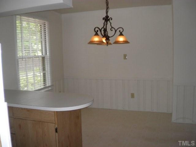 2221 Lash Avenue Raleigh, NC 27607 - Photo 8 of 17 Large Breakfast Room with panel wainscoting. Breakfast Area
