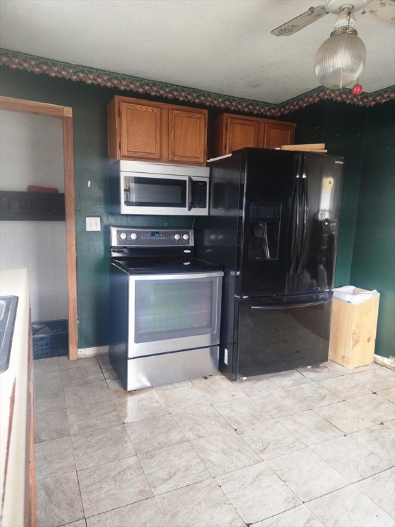 2 Alice Street Montague, MA 01376 - Photo 11 of 18 a view of an empty room with a staircase