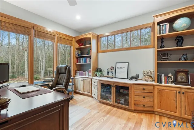 a living room with fireplace furniture and a window