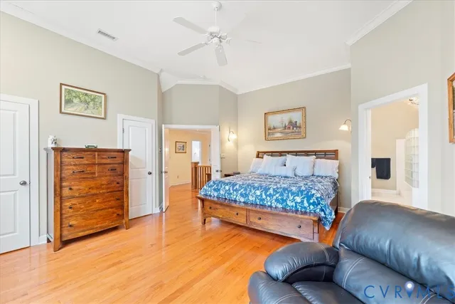 a bathroom with a granite countertop toilet sink and mirror