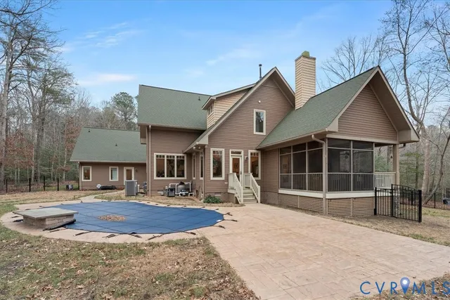a view of backyard with seating space and trees