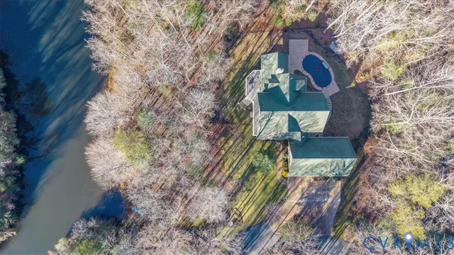a hallway with wooden floor and furniture