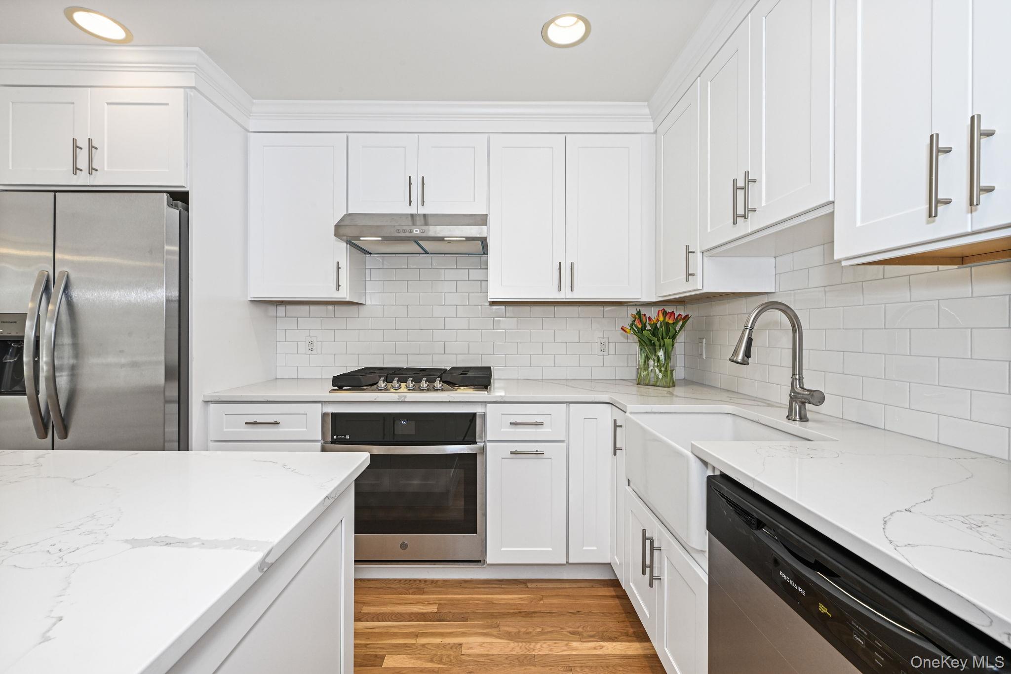 125 Cross River Road Mount Kisco, NY 10549 - Photo 16 of 46 Kitchen with quartz countertops, subway tile backsplash and apron sink