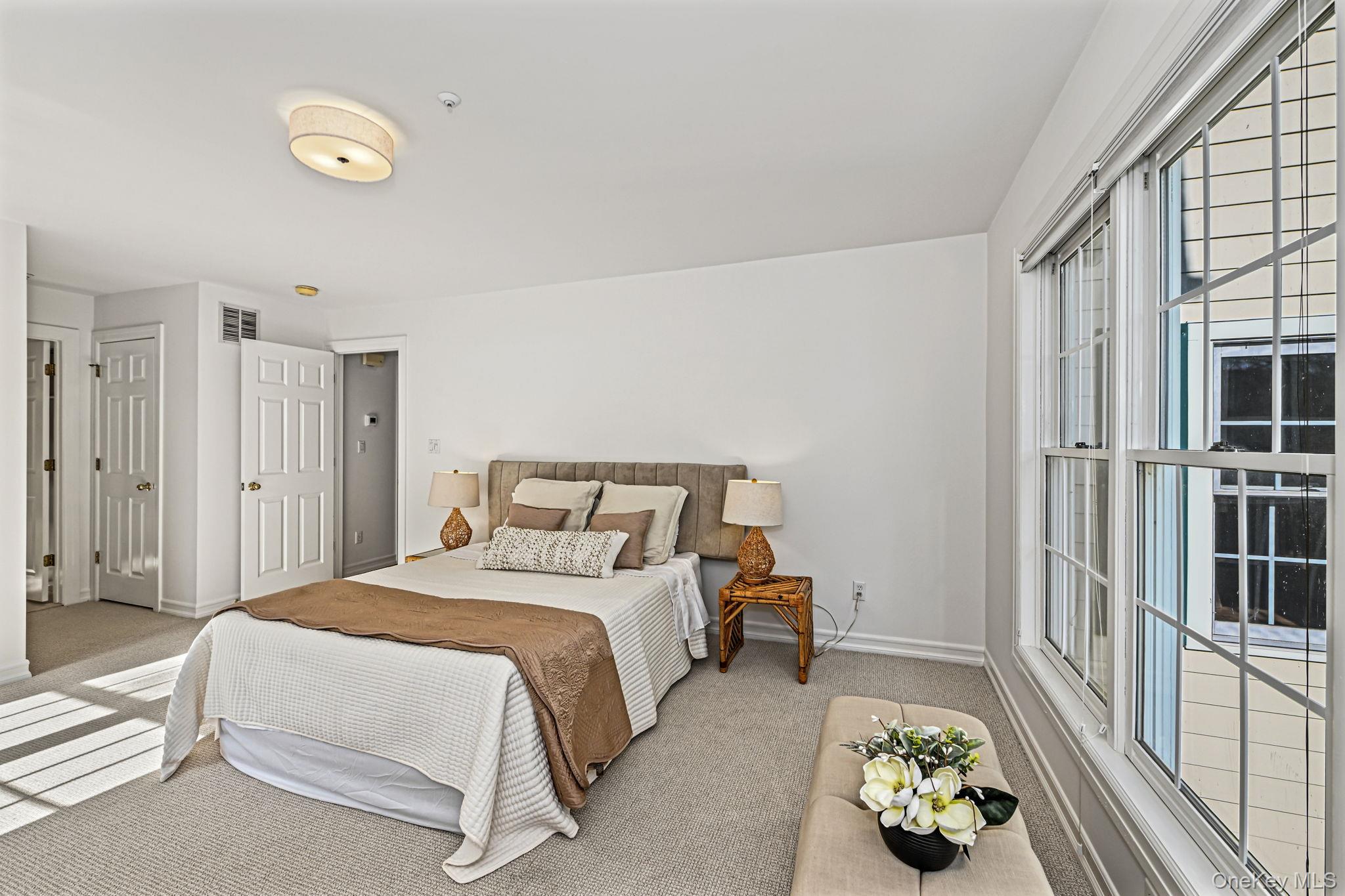 125 Cross River Road Mount Kisco, NY 10549 - Photo 19 of 46 Large, light filled primary bedroom, with 2 walk in closets and Primary En-suite