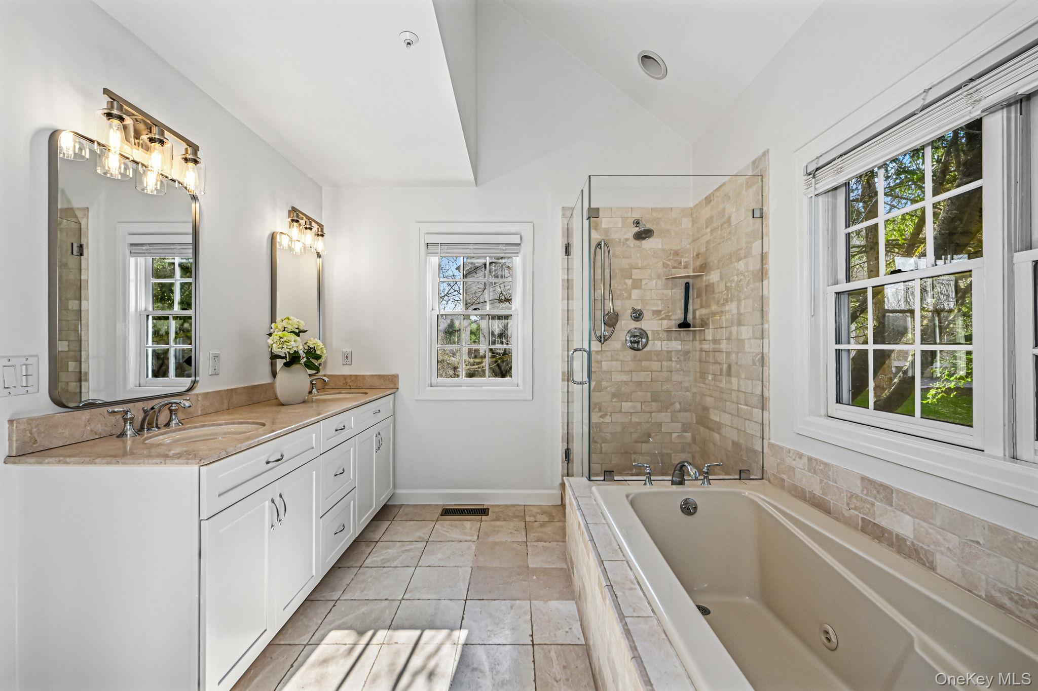 125 Cross River Road Mount Kisco, NY 10549 - Photo 22 of 46 Primary Bathroom with dual sinks, large shower, jacuzzi bath and separate water closet