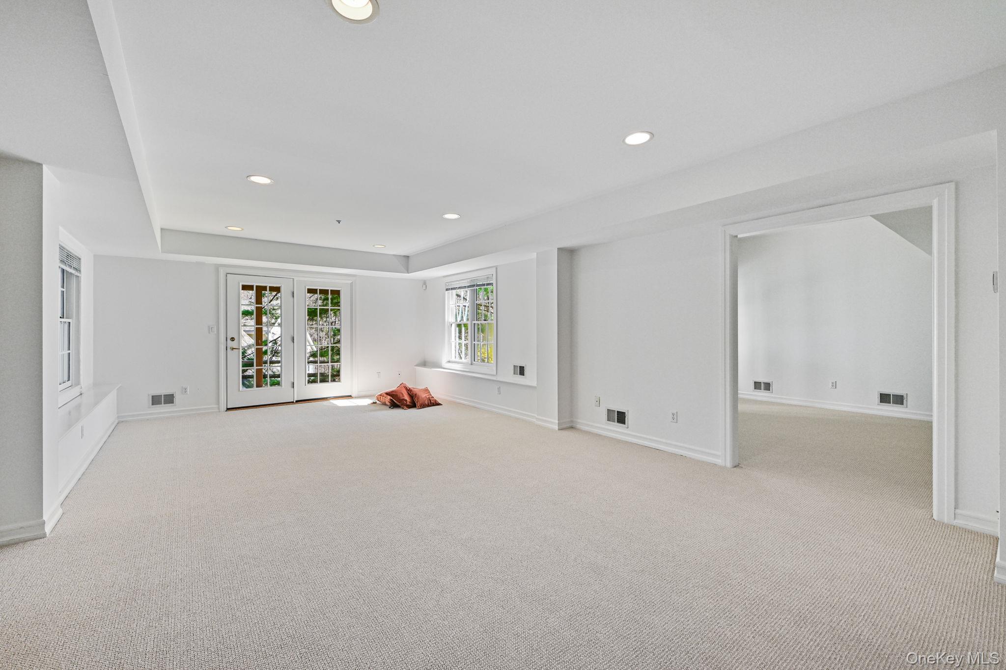 125 Cross River Road Mount Kisco, NY 10549 - Photo 31 of 46 Large Recreation Room on lower level with door to patio