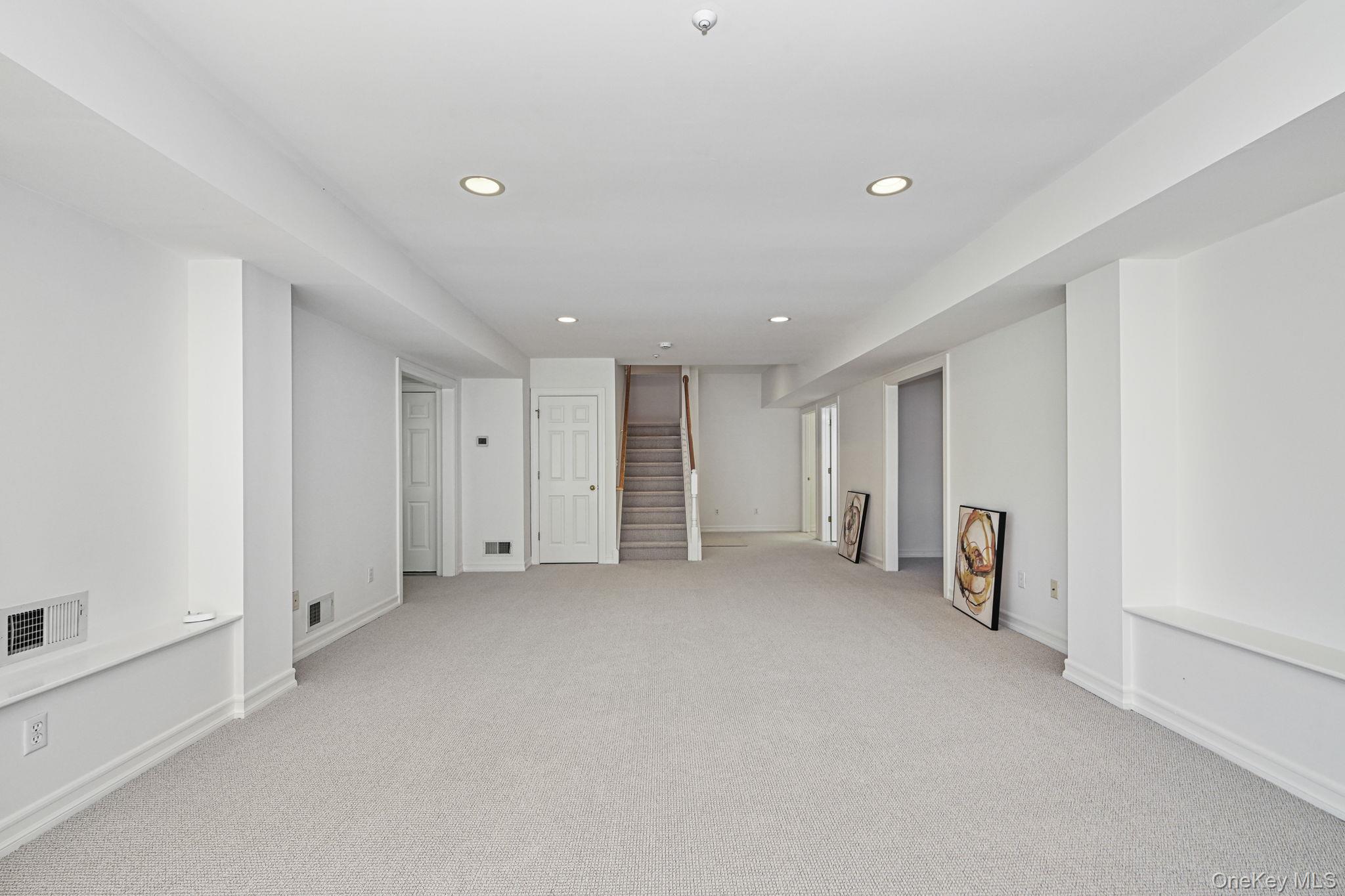 125 Cross River Road Mount Kisco, NY 10549 - Photo 32 of 46 Large recreation room on lower level, with doors to 2 Bonus rooms, Storage rooms, Full Bathroom, Laundry Room and Mechanical Room