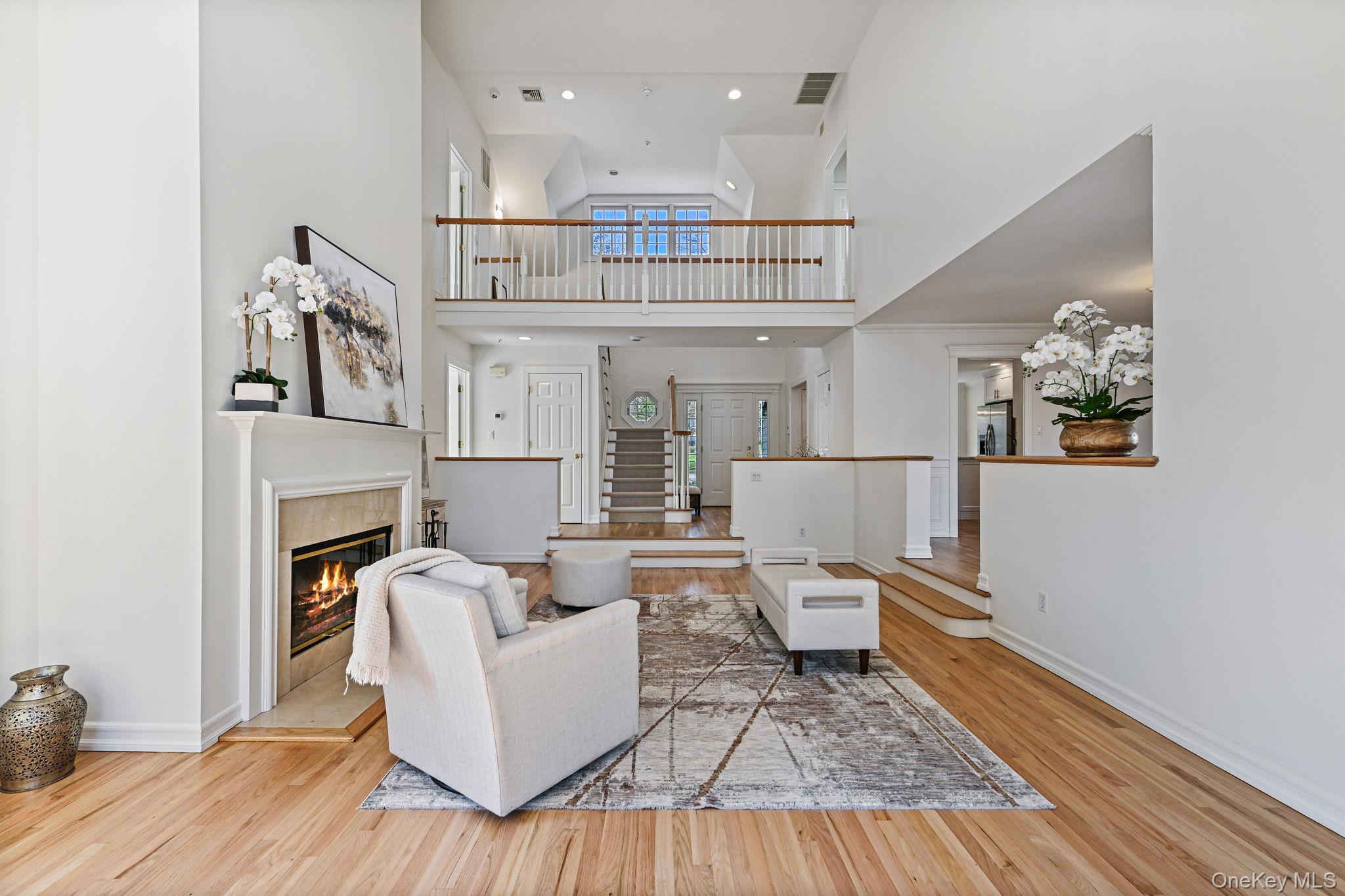 125 Cross River Road Mount Kisco, NY 10549 - Photo 9 of 46 Living room with soaring ceilings and open aspect to second floor