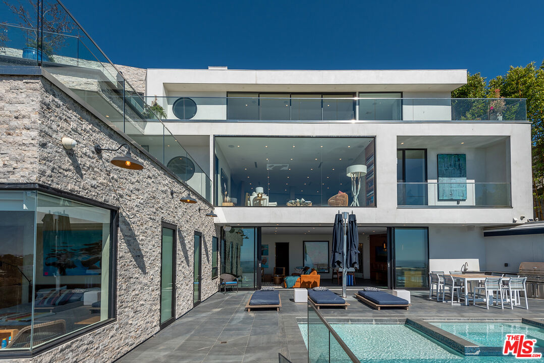 a view of a building with sitting area