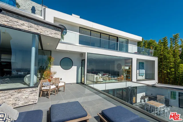 swimming pool view with a seating space