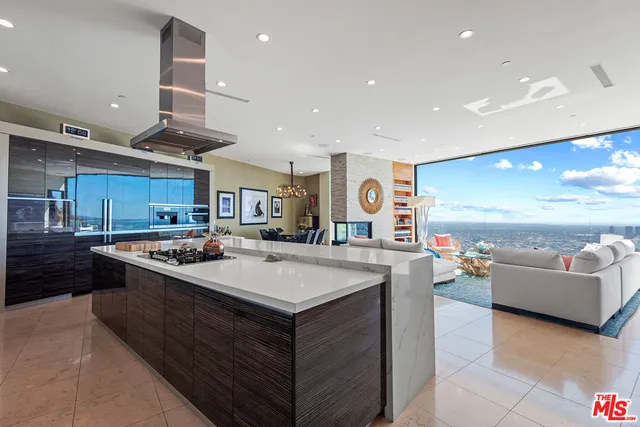 a large kitchen with stainless steel appliances lots of counter top space